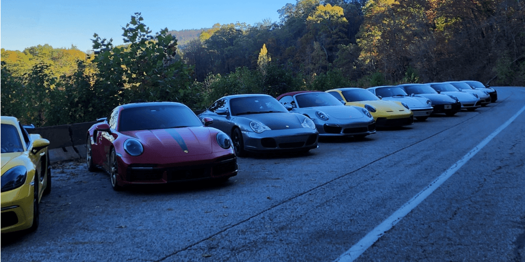 A row of 10 different colored Porsche 911's